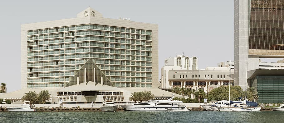 beige concrete building, city, creek, dubai, balconies, bank, cityscape, residential building, uae, emirates