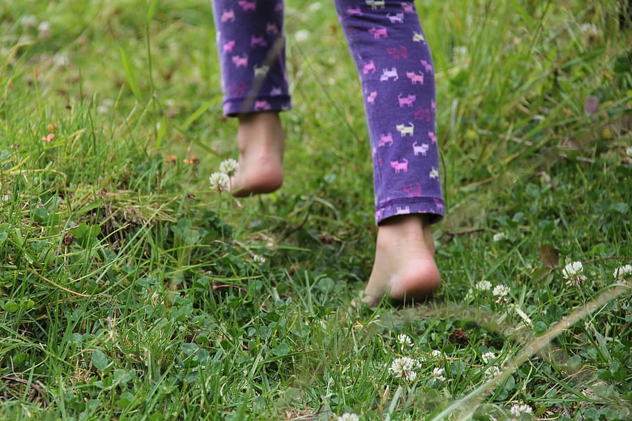 person, purple, animal print pajama pants, grass field, barefoot, child, people, girl, fingers, feet