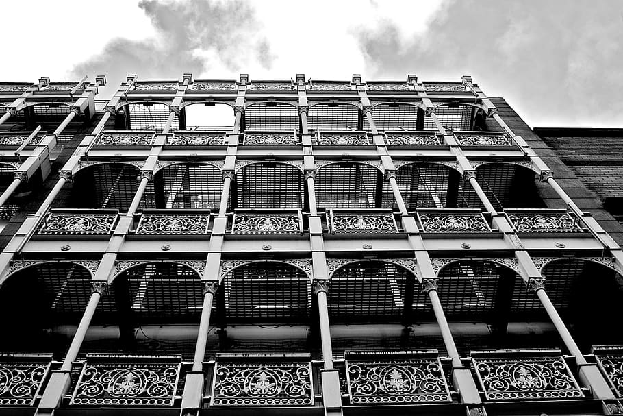 building, architecture, sky, clouds, black and white, built structure, building exterior, low angle view, window, day