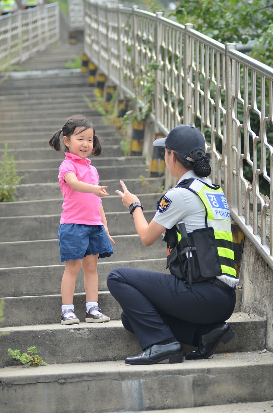 police woman, kneeling, stair, standing, girl, daytime, children's, female police, policewomen, stairs