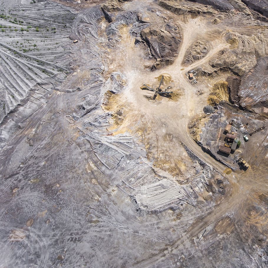bird, eye view photography, brown, dirt land, drone, knoll, helicopter, bedrock, truck, stone