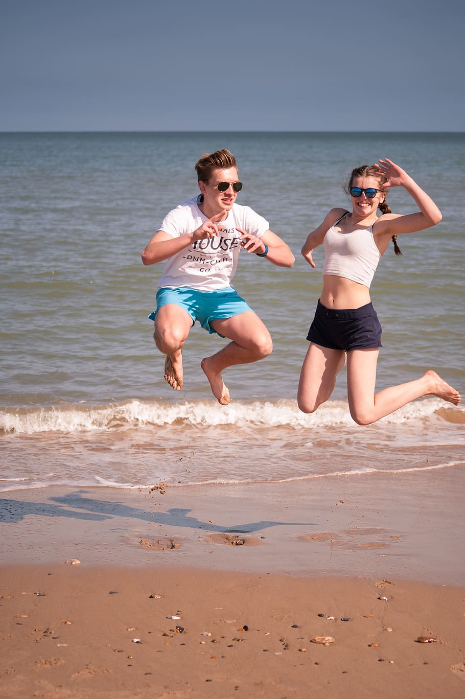 people, jumping, beach, boy, girl, fun, play, ocean, water, sea