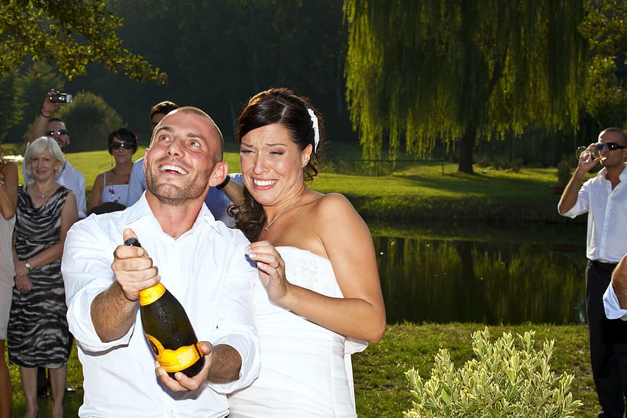 man opening wine bottle, woman, feast, formal wear, cheerfulness, festivity, wine, sparkling wine, romance, marriage