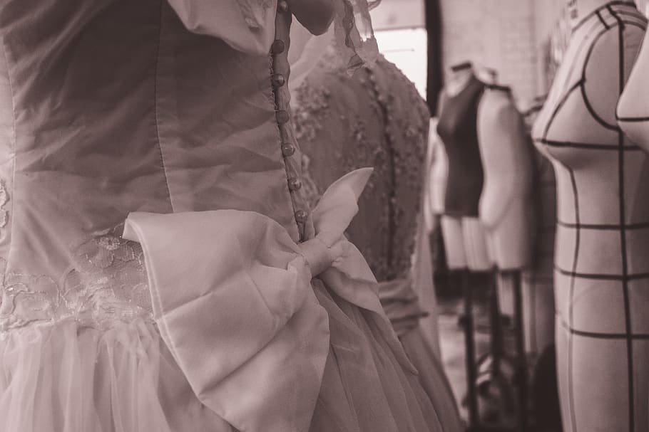 dress, clothing, ribbon, store, black and white, midsection, focus on foreground, holding, traditional clothing, women