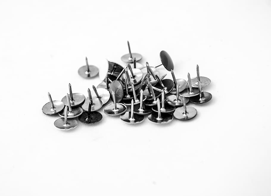 button, thumbtacks, spikes, an injection, studio shot, white background, indoors, large group of objects, metal, copy space