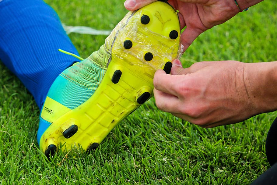 football, soccer shoes, repair, help, adhesive tape, sports, footballer, shoes, puma, grass