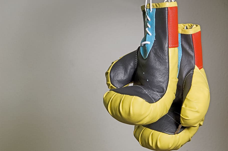 pair, black, boxing gloves, box, hanging, sport, yellow, copy space, indoors, studio shot