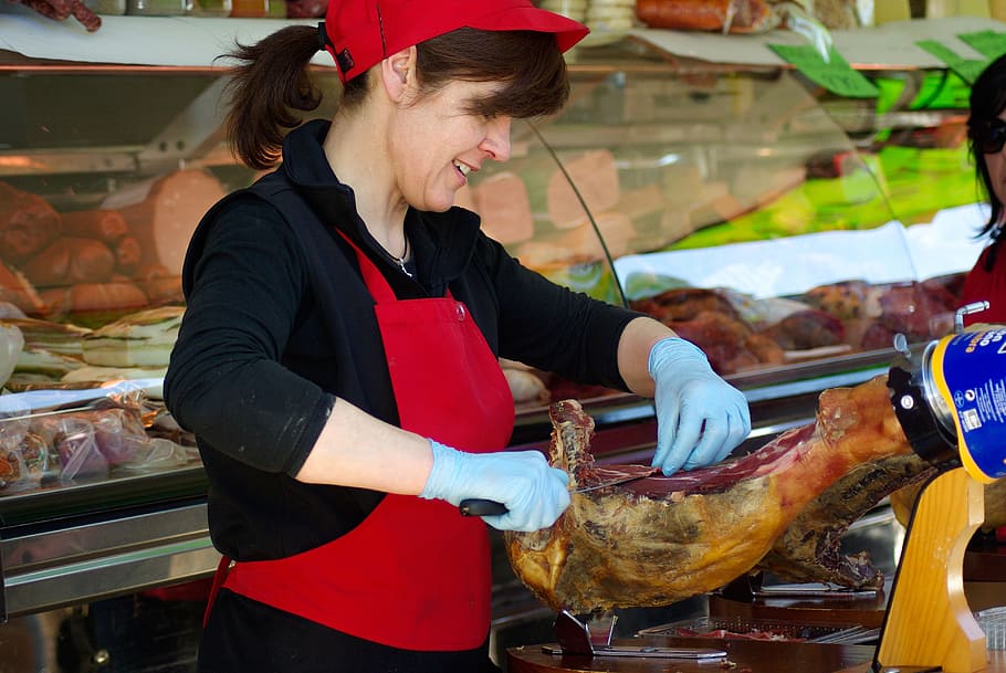 woman, wearing, red, apron, ham, pork, market, butcher, delicatessen, one person