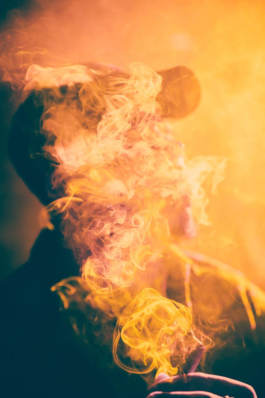 people, man, smoking, smoke, heat - temperature, burning, orange color, smoke - physical structure, close-up, fire