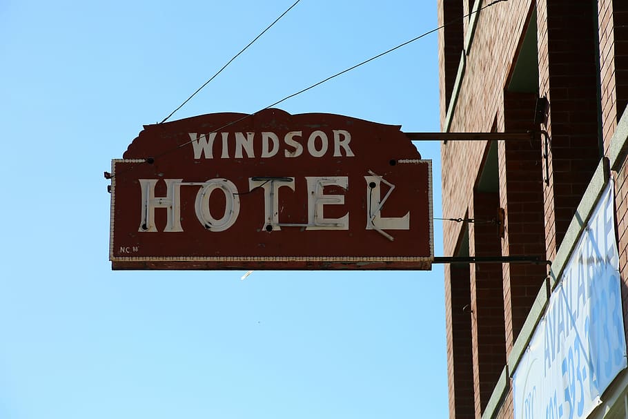 Sign, Motel, Windsor Hotel, hotel, building exterior, blue, text, neon, old-fashioned, low angle view