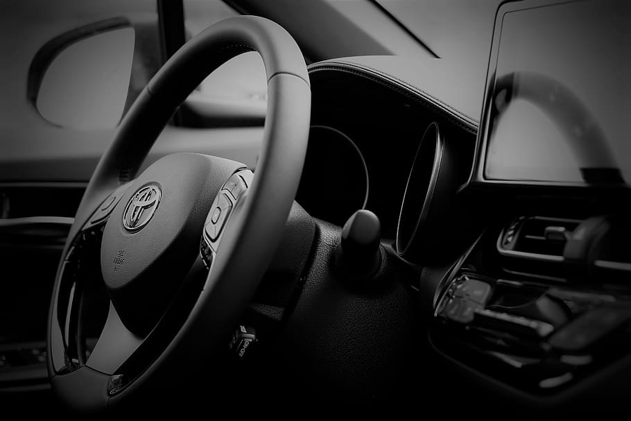 grayscale photography, toyota vehicle steering wheel, toyota c-hr, hybrid, car interior, car, motor vehicle, transportation, mode of transportation, vehicle interior