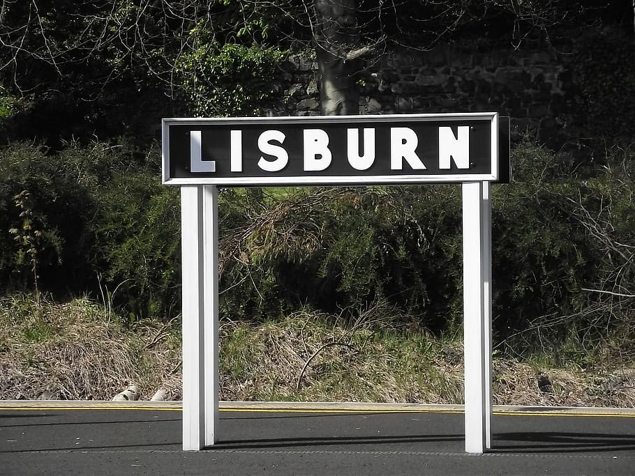 train station, sign, lisburn, northern ireland, black, white, wood, steel, sunlight, text