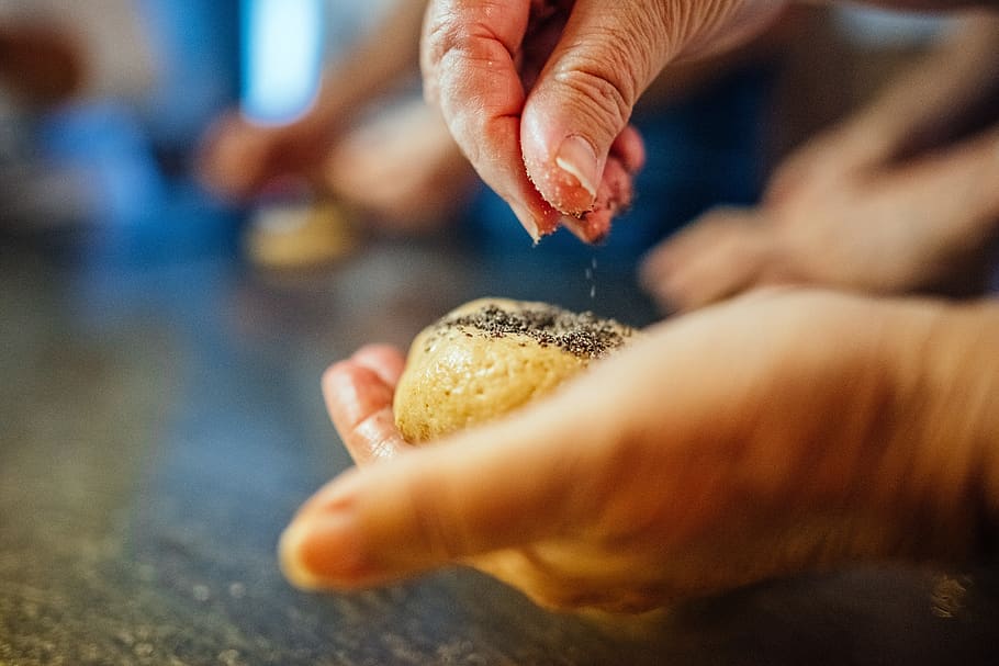 bread baking, roll, pastries, human hand, hand, human body part, close-up, food and drink, one person, indoors