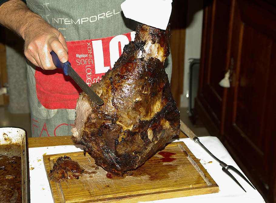 meat, game boar, hunting, knife, one person, food and drink, food, indoors, midsection, freshness