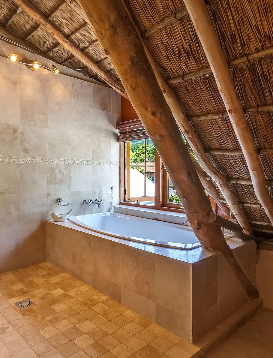 cape dutch bathroom, bath, bathtub, garden view, window, thatch roof, wood, indoors, inside, interior