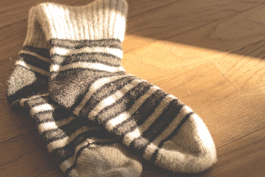socks, footwear, clothing, wooden, floor, sunlight, indoors, wood, high angle view, textile