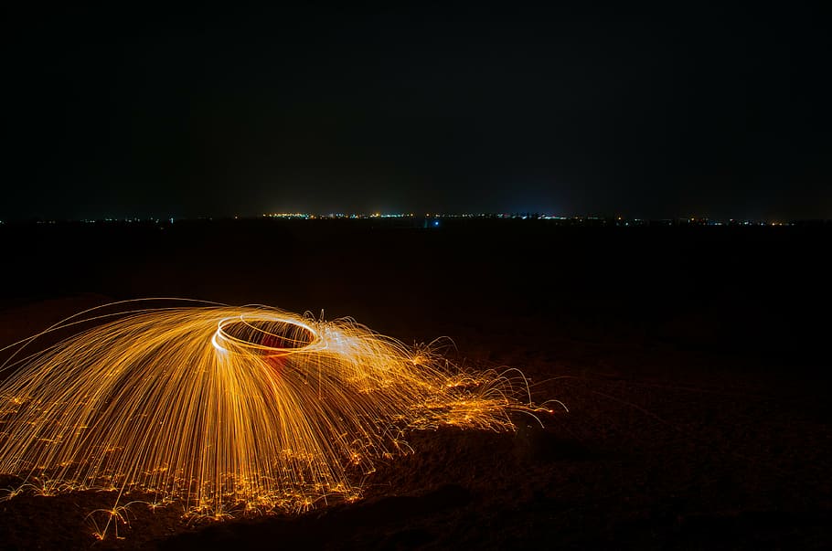 light painting, color, sparks, night, motion, illuminated, long exposure, glowing, land, sky