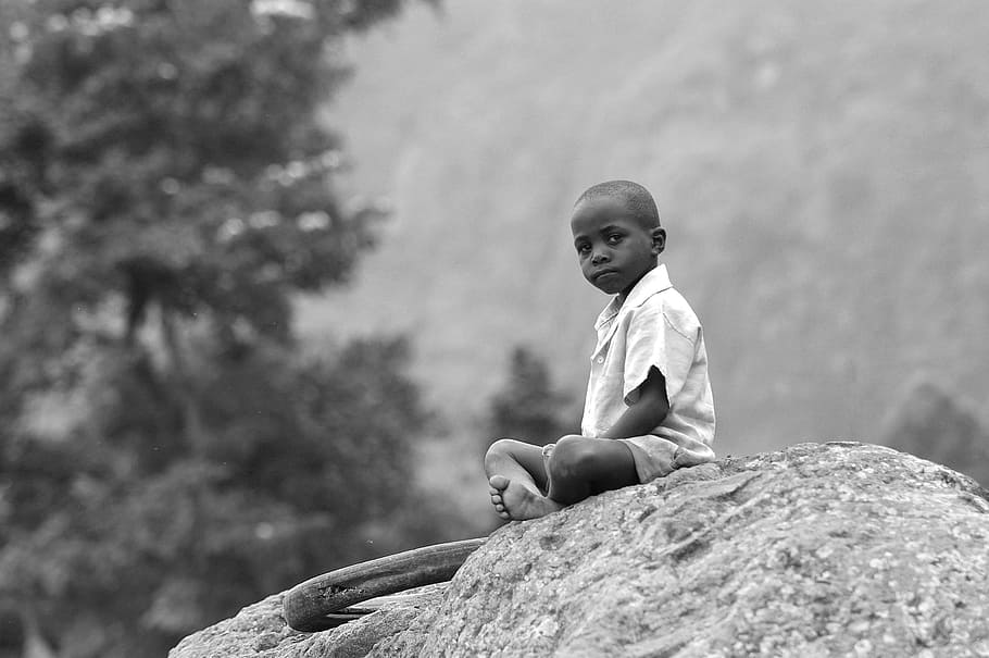 grayscale photography, boy, sitting, rock, outdoor, Africa, Child, Humble, young, kid