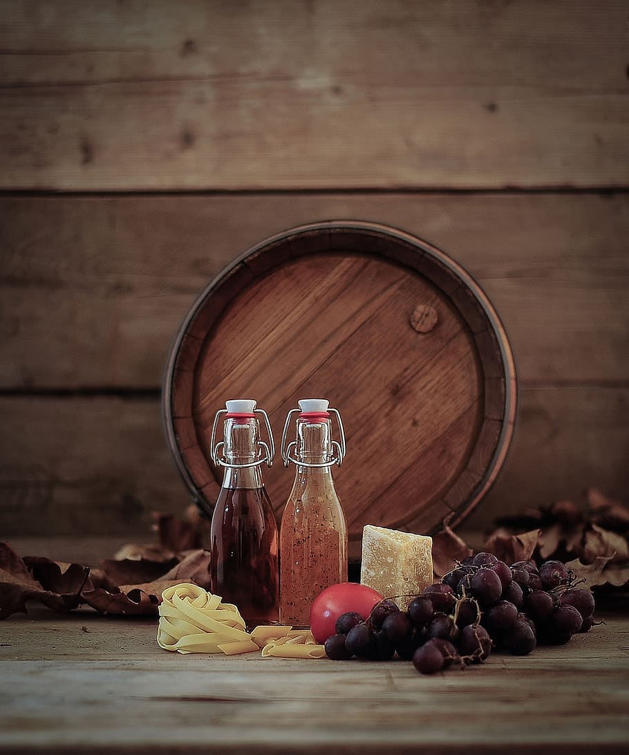 wine barrel, grapes, oil bottle, vinegar bottle, pasta, food and drink, wood - material, food, table, refreshment