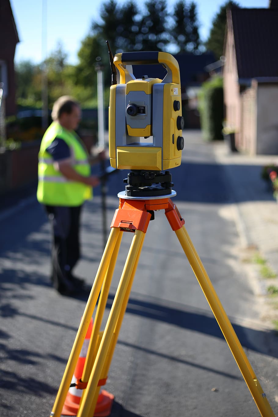 surveying, geodesy, equipment, instrument, land surveyor, stakeout, reflective clothing, yellow, one person, safety