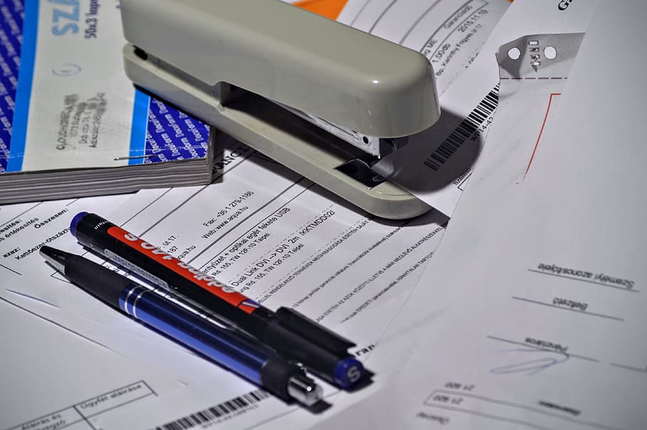 gray stapler, stapler, pen, paperwork, invoice, invoice book, paper, office, accounting, bookkeeper