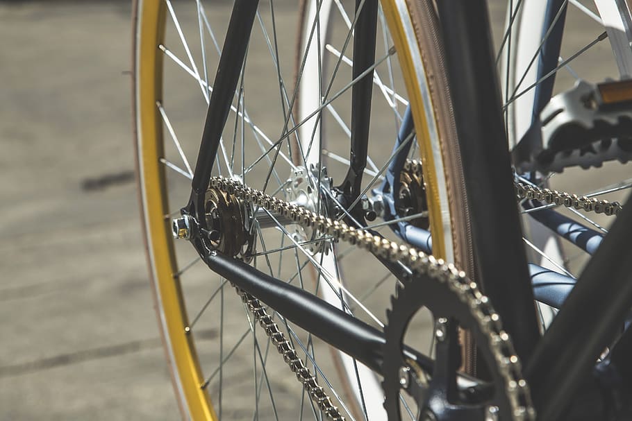 selective, focus photography, black, bicycle wheel, concrete, pavement, bike, chain, close-up, spokes