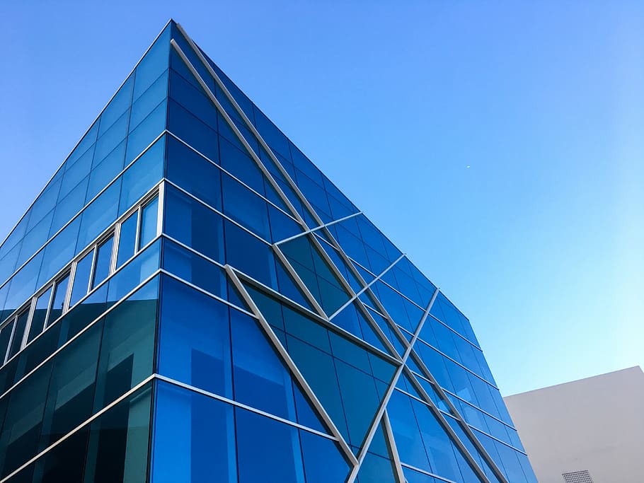 the atmosphere, blue, company building, architecture, built structure, sky, building exterior, modern, glass - material, office building exterior