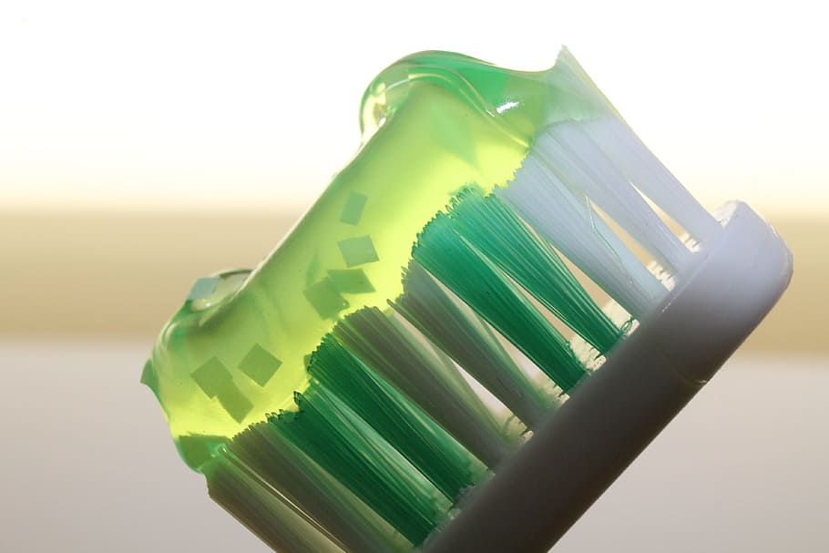 close-up photo, toothpaste, white, green, toothbrush, luminous green, bristles, child, dentist, teeth