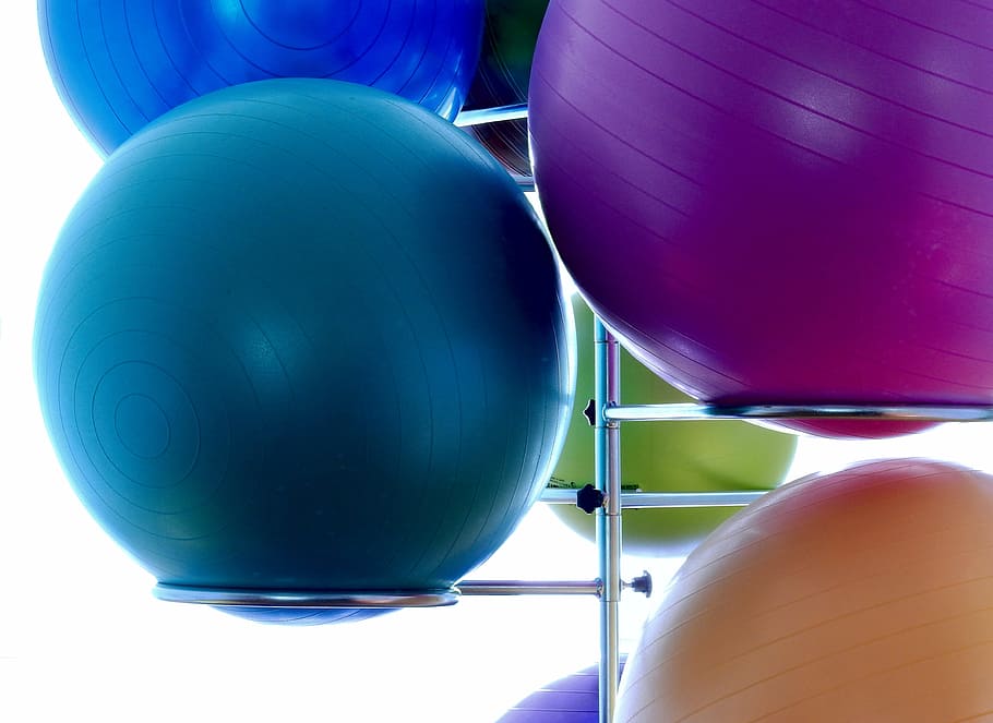 two, blue, one, purple, orange, stability balls, stainless, steel rack, medicine ball, ball