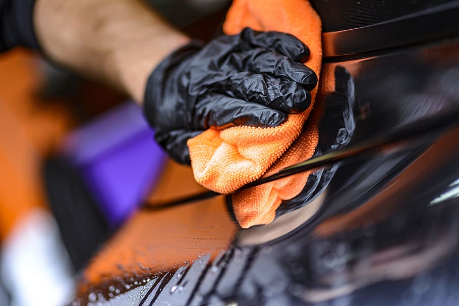 person, wearing, black, glove, holding, orange, textile, black glove, cleaning, steam