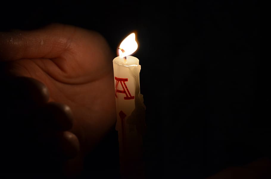 easter candle, easter, candlelight, flame, fire, burning, human hand, candle, one person, human body part