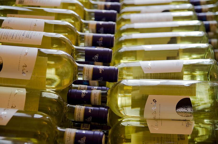 wine bottles, white wine, tuscany, bottle, benefit from, wine, indoors, large group of objects, alcohol, wine bottle