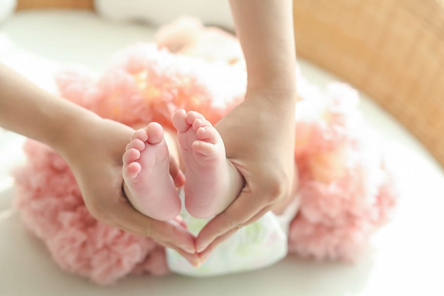 person, holding, baby foots, selective, focus photography, pregnant women, paternity, mother-to-child, life, human body part