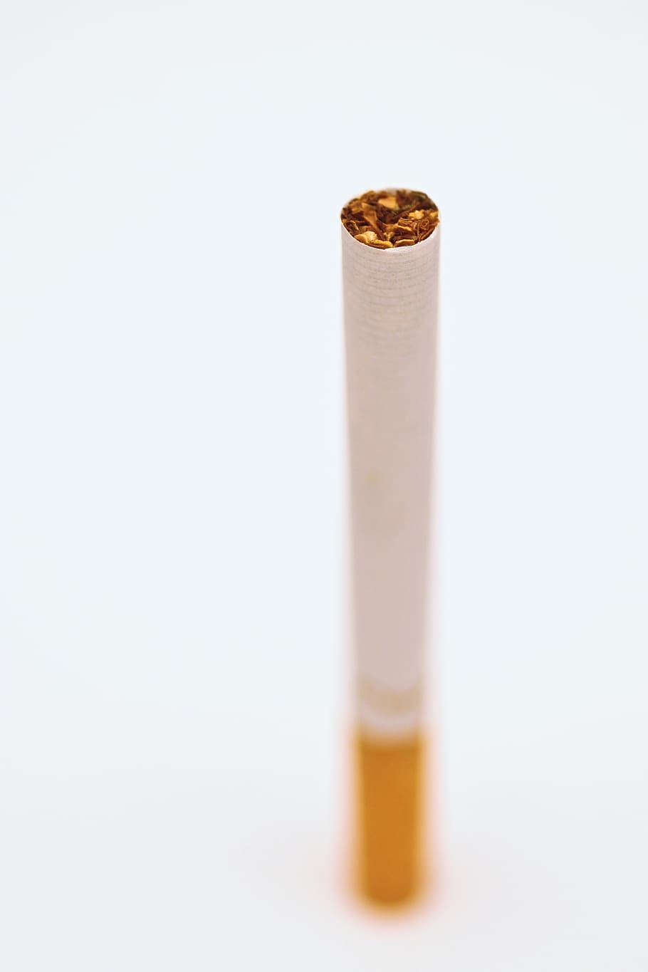 cigarette, tobacco, smoke, white background, studio shot, pencil, indoors, single object, eraser, close-up