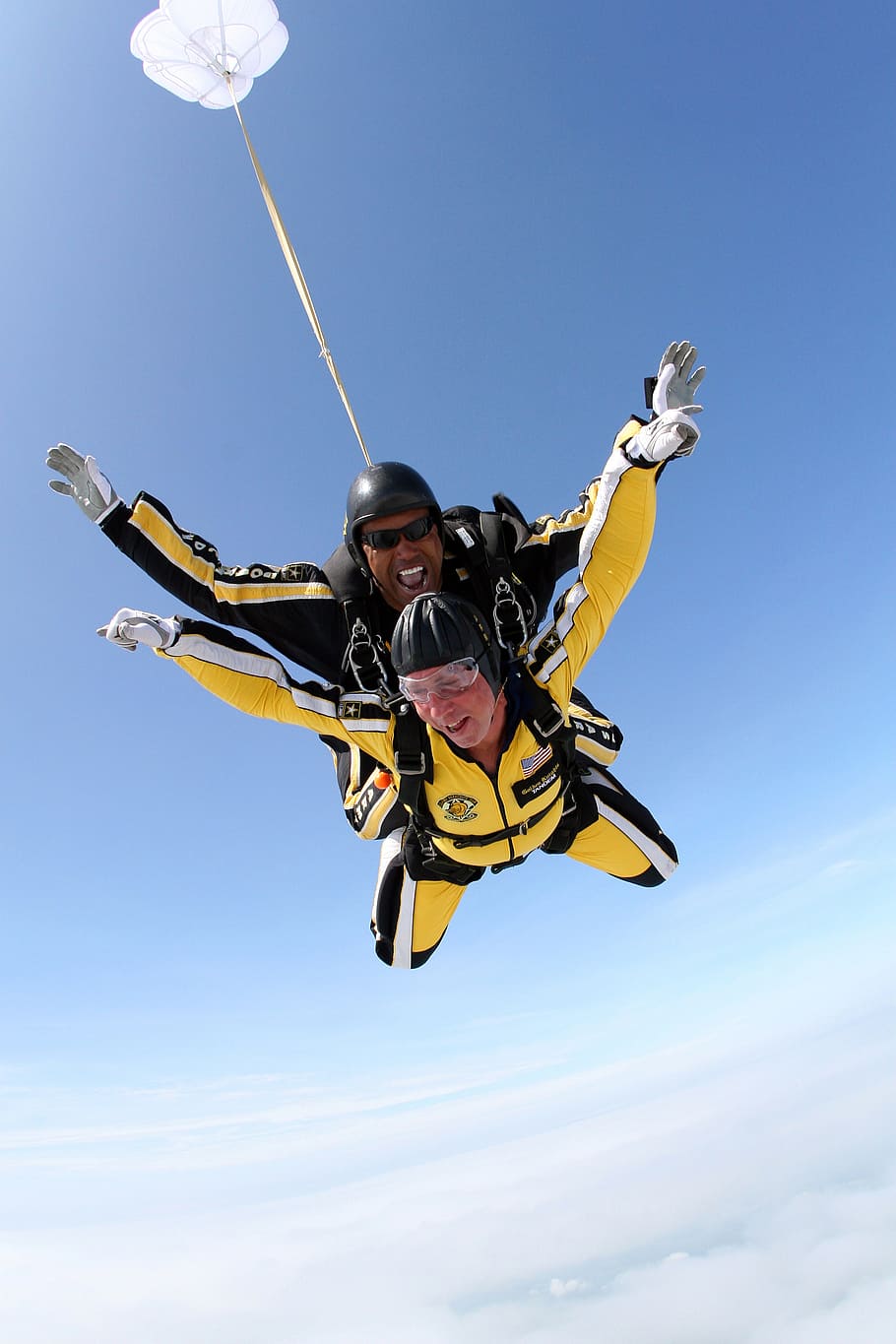 man, woman, wearing, yellow, suit, riding, parachute, clouds, tandem skydivers, skydivers