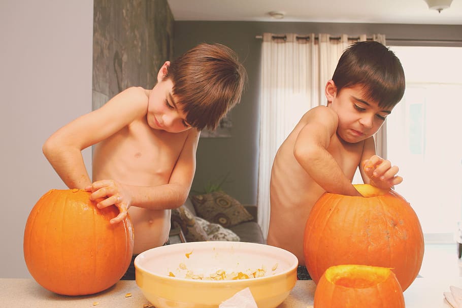 two, boys, putting, hands, inside, pumpkins, people, kid, children, twin