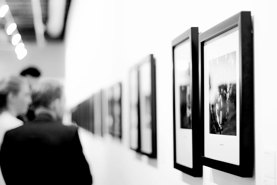 man, standing, front, painting, black, white, photos, frame, wall, black and white