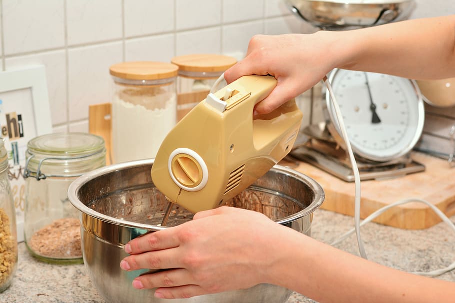 man, using, electric, mixer, touching, gray, stainless, steel bowl, hands, stir