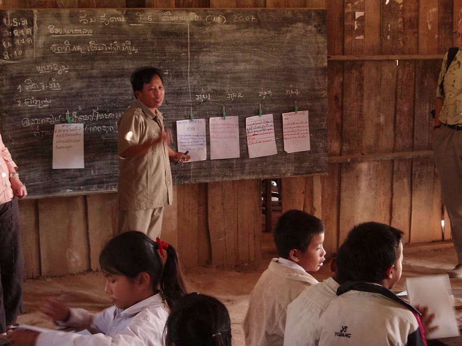 man, standing, chalk board, students, primary school, village, laos, children, instruction, southern laos