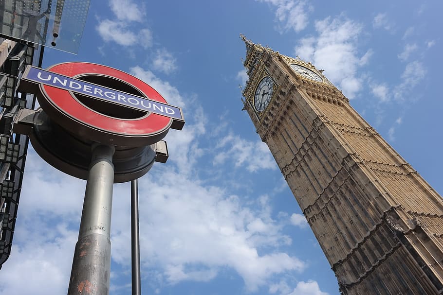 low-angle photo, elizabeth tower, underground, post signage, daytime, big ben, london, parliament, tower, clock