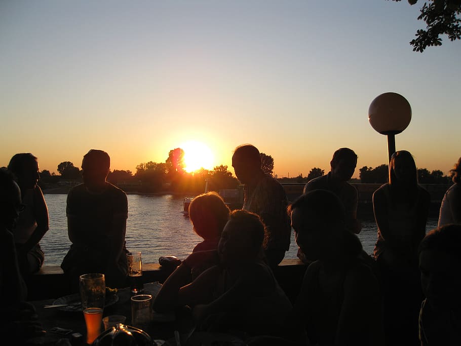 silhouette photo, people, sitting, body, water, golden, hour, beer garden, sunset, fun
