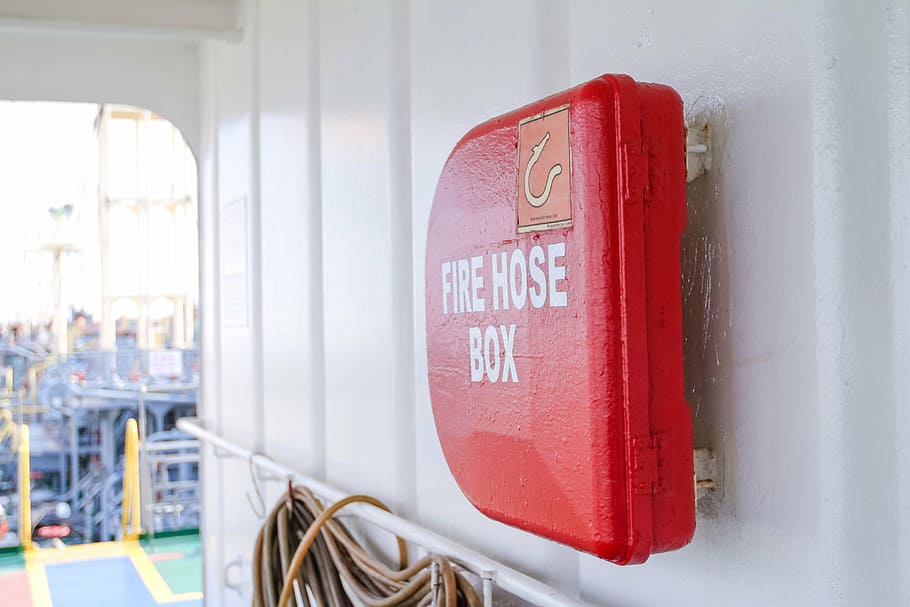 red, fire hose box, metal wall, ship, safety, box, inside, transportation, day, close-up