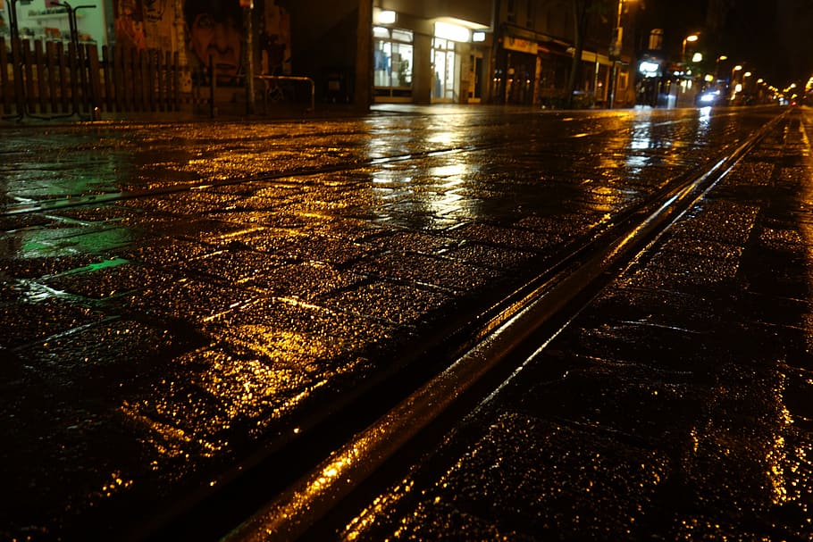 rail, rain, cobblestones, weather, wet, road, light, dark, night, architecture