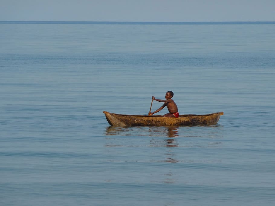 boy rowing, brown, canoe, malawi, malawi lake, lake malawi, child, boot, a tree, paddle