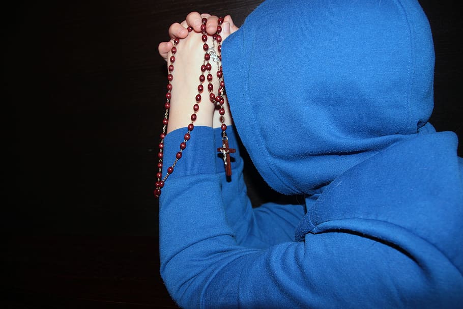 person, wearing, blue, pullover hoodie, praying, rosary, pullover, hoodie, prayer, religion