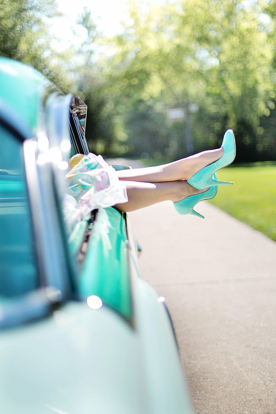 selective, focus photograph, person, wearing, teal pump-heeled shoes, woman's legs, high heels, vintage car, turquoise, 1950s