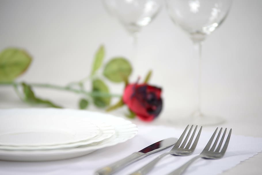 three, round, white, ceramic, plates, silver bread knife, two, forks, elegant tableware, rose