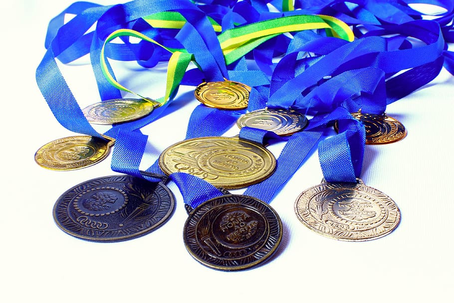 round gold-colored medal, medal, awards, honor, merit, winner, champion, school olympics, coin, finance