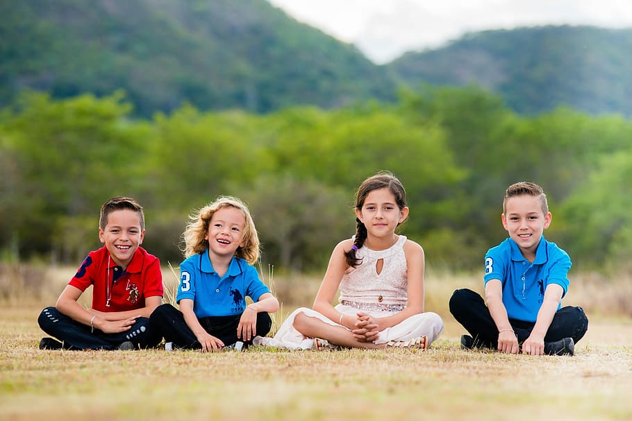 four, boy, girl, sitting, brown, grass field, lifestyle, nature, ease, fun