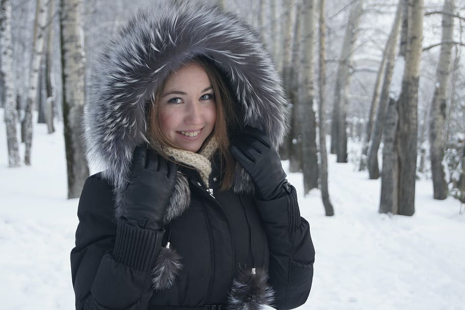 smiling, woman, wearing, parka coat, bare, trees, snow ground, winter, girl, smile